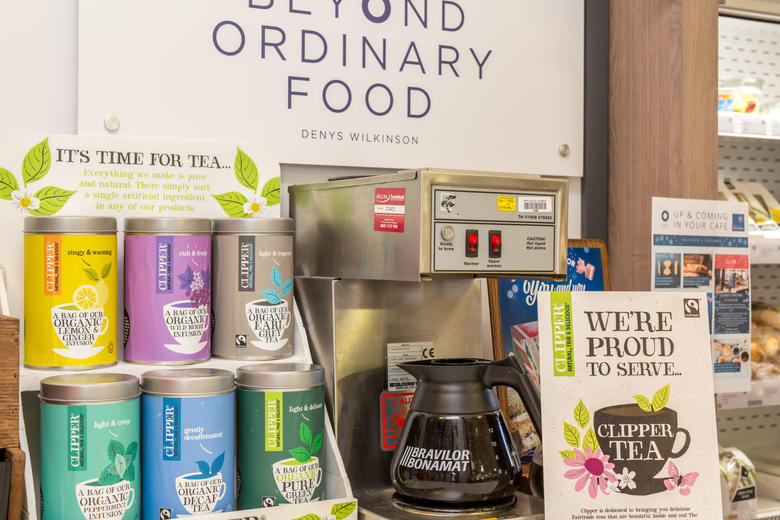 Photo of a selection on Clipper Tea jars and a full pot of black coffee