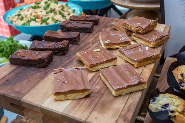 Photo of caramel shortbread and brownies arranged on a serving board