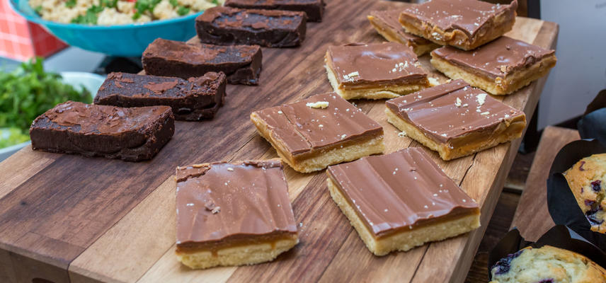 Photo of caramel shortbread and brownies arranged on a serving board