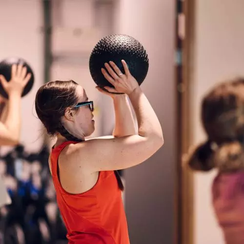 Woman exercising with a gym ball
