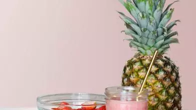 fresh fruit with a glass of strawberry smoothie
